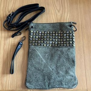 Olive green canvass cross body bad with studs.  Wristlet handle too.